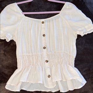 Gently used women’s fashion top in cream